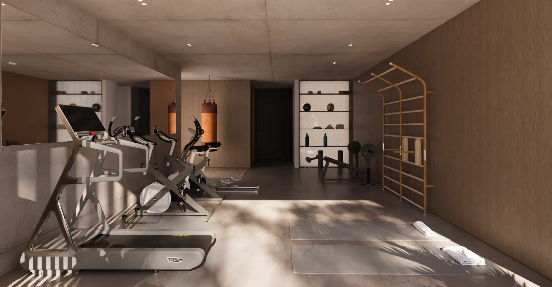 Gimnasio privado en Hábita Freire, equipado con máquinas modernas como cintas de correr y bicicletas fijas, además de una zona de entrenamiento funcional con saco de boxeo y barras para ejercicios. El espacio está diseñado con un estilo minimalista y materiales cálidos que aportan una sensación de confort mientras se mantiene un ambiente propicio para la actividad física